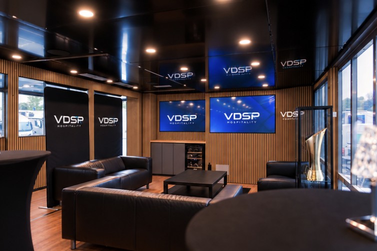 VDSP-branded lounge with leather seating and screens