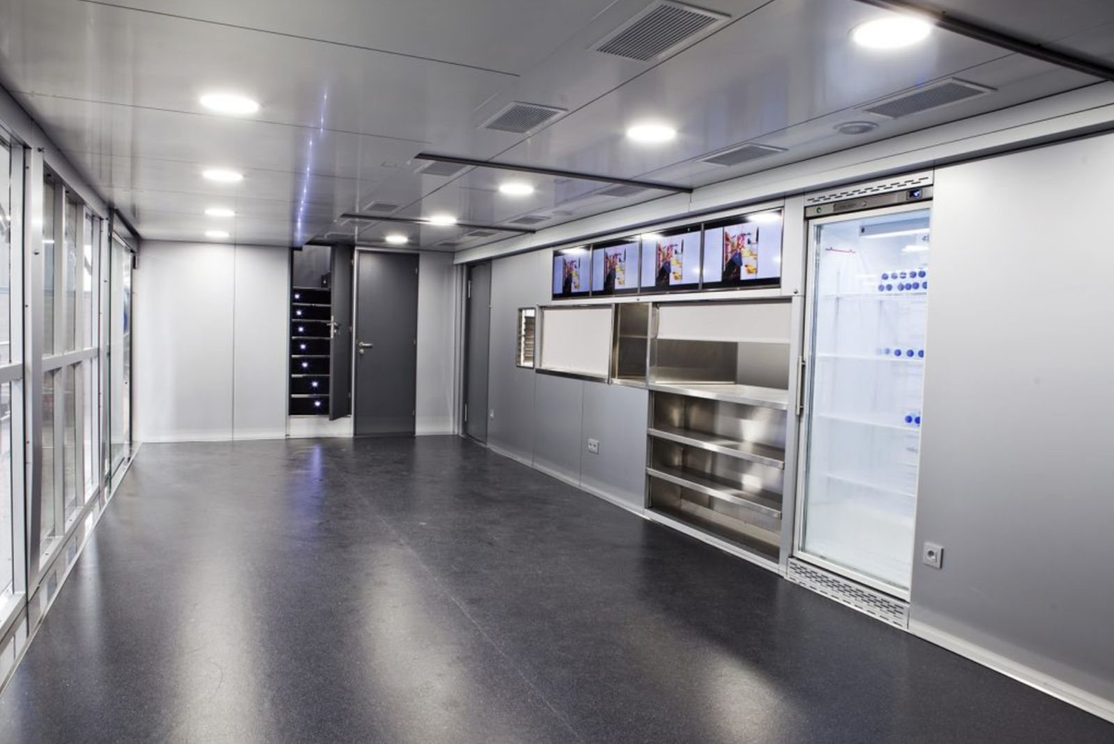 Service area with pass-through counter and glass-door fridge