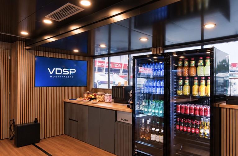 Bar counter with glass-front beverage fridges